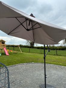 Large parasol and two weights. Bought for 170 last summer. Selling due to getting a pergola installed