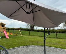 Large parasol and two weights. Bought for 170 last summer. Selling due to getting a pergola installed