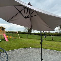 Large parasol and two weights. Bought for 170 last summer. Selling due to getting a pergola installed