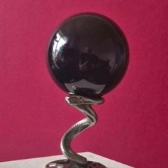 Obsidian glass ball and metal Serpent stand.