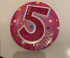 Birthday badge and candle girl age 5