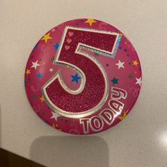 Birthday badge and candle girl age 5