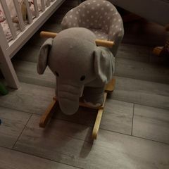 Children rocking elephant