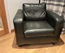 2 Black faux leather armchairs