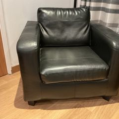 2 Black faux leather armchairs