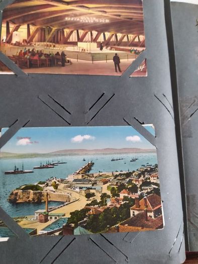 Old postcard album with 80 cards from 1914 to 1955,plus 10 miniature photos of New York,5 old John Hinde,postcards,3 old Iraqui postcards