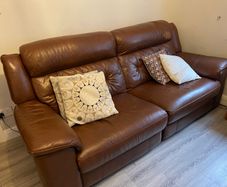 Leather electric recliner sofa with matching armchair and footstool
