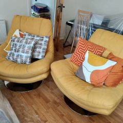 2 Yellow Swivel Armchairs