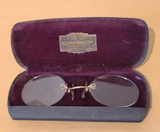 Very collectable vintage clip on glasses from Nora Mooney optician's