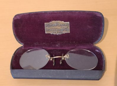 Very collectable vintage clip on glasses from Nora Mooney optician's