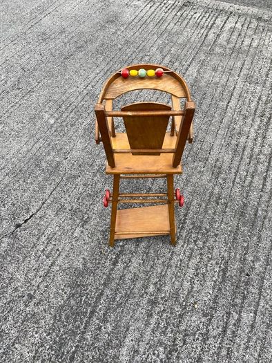 Vintage wooden doll high chair FROM THE 1930S featuring a built-in play tray with a wire bead