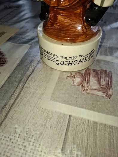 1950s to 70s Working Musical Decanter Hobo Clown Sitting on a Barrel. The base plays the tune Show Me the Way to Go Home, reminded me of the song from Jaws