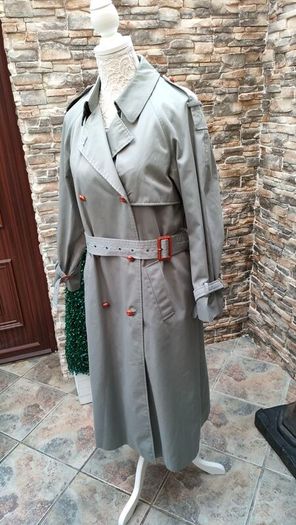Vintage Nuage ladies trenchcoat Approximately late 90s early 00s Size 10 on label The colour is a pale bluey grey with brown buttons It's got an inner lining that can be removed