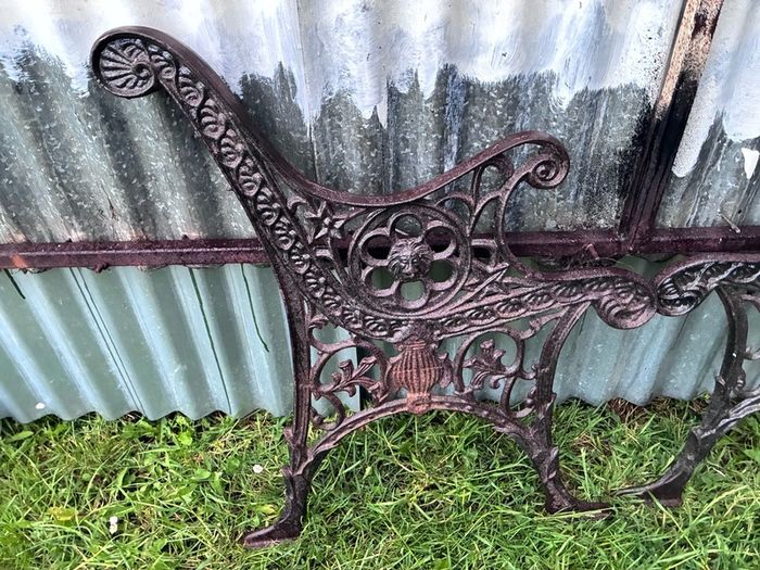Pair of decorative cast iron bench ends