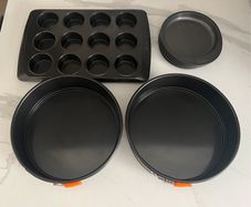 Pyrex, Wilton & Le Creuset tins