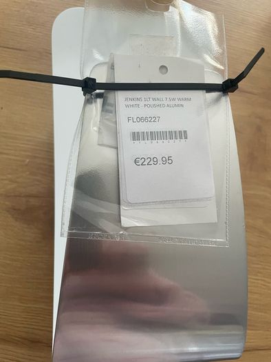 Jenkins 1lt Wall fixture in a white and polished aluminium finish