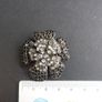 Flower-shaped Brooch with black and white crystals Image 3