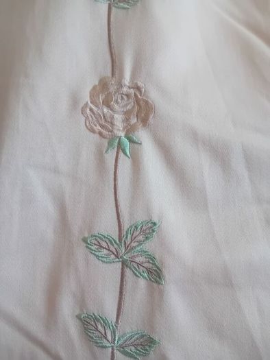 A pair of vintage embroidered curtains