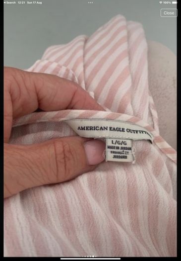 top American eagle a size large cold shoulder effect with frilled detail stripe