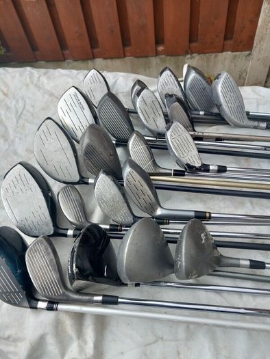 A selection of golf clubs and bags. NOT SELLING SEPARATE