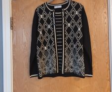 Mudflower Black Jumper.  S.  S-M - 12.  New.