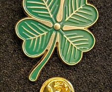 Shamrock , pin back badge.