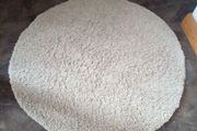 round cream rug
