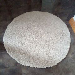 round cream rug
