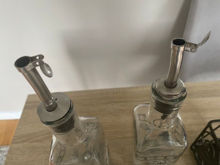 Reduced Set of tall oil and vinegar bottles in stand