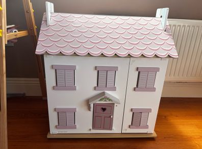 Wooden dolls house with accessories