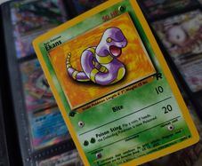 Ekans ! FIRST EDITION ! Rare Near Mint- Mint Condition ! from Team Rocket Set ! 2000 ! Pokemon Card !
