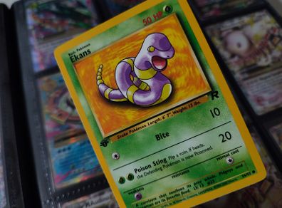 Ekans ! FIRST EDITION ! Rare Near Mint- Mint Condition ! from Team Rocket Set ! 2000 ! Pokemon Card !