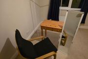 table , chair , mirror and cloths