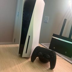 PlayStation 5 and racing steering wheel with TV for sale