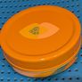Colourful circular tin box Image 2