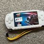 Modded Sony White PSP 1000 with Over 100 Games with Case and Charger. Image 7