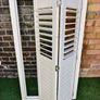 Vintage-style louvered white internal window shutter Image 4