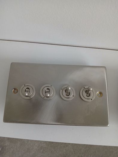 Brushed steel toggle light switches - 3 and 4 gang