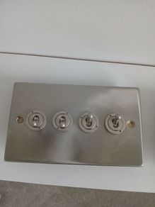 Brushed steel toggle light switches - 3 and 4 gang