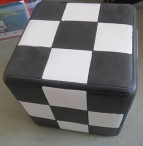 Harlequin checkered black white stool table