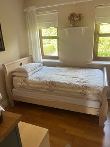 Beautiful cream single sleigh bed. Mattress included.