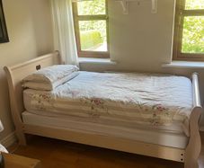 Beautiful cream single sleigh bed. Mattress included.