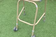 Child's walking aid (Zimmerframe) gold colour