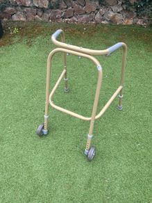 Child's walking aid (Zimmerframe) gold colour