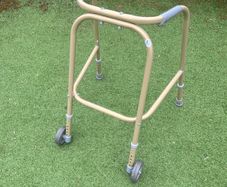 Child's walking aid (Zimmerframe) gold colour