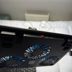 two stands for a laptop with a fan