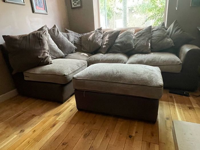 L shaped couch with poof