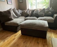 L shaped couch with poof