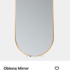 Rose gold oval mirror