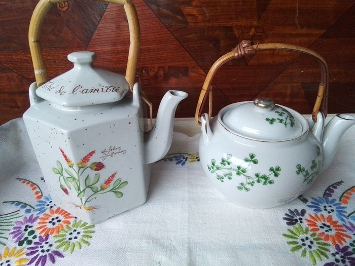 Two Wicker Handled Teapots